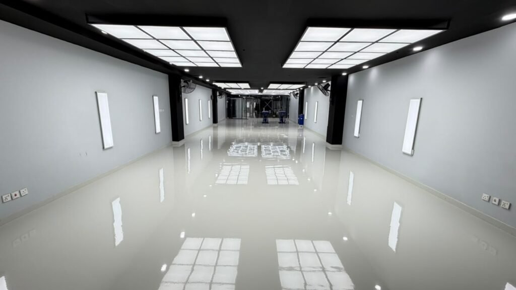 professional car detailing studio main work bay illuminated by Newon Lighting hexagonal and 2x2 ft surface-mounted LED panels