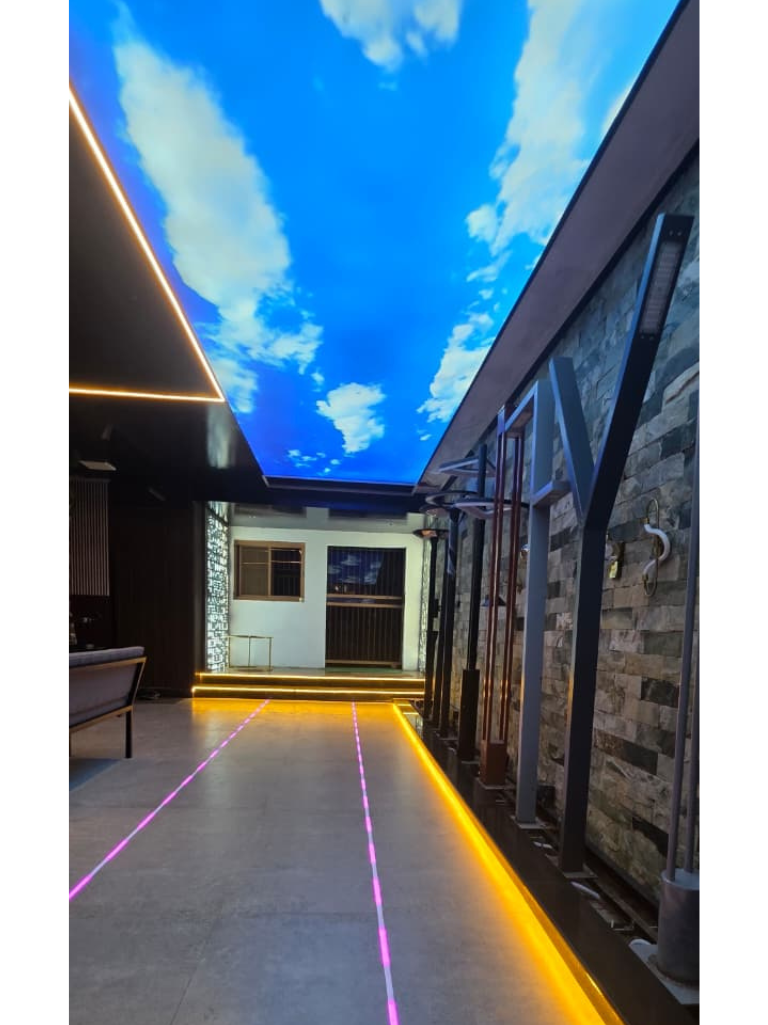 Day-themed-cloudy-blue-sky-backlit-Barrisol-stretch-ceiling-—-Newon-Islamabad