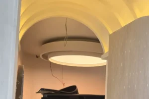 Finished composition of five oval and round white plain backlit stretch fabric ceilings glowing above the spa salon treatment and reception zones in Bahria Town Islamabad
