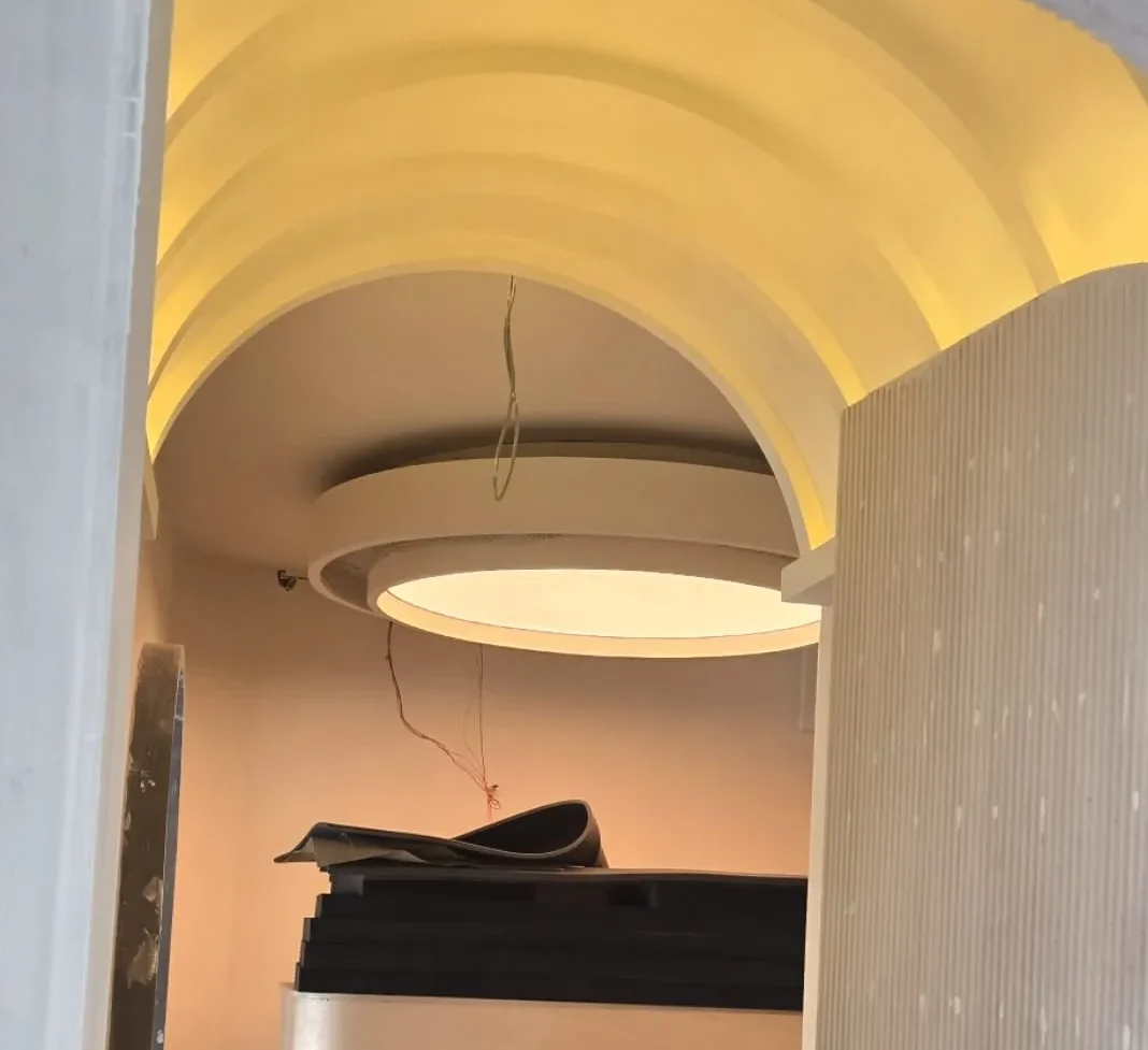 Finished composition of five oval and round white plain backlit stretch fabric ceilings glowing above the spa salon treatment and reception zones in Bahria Town Islamabad