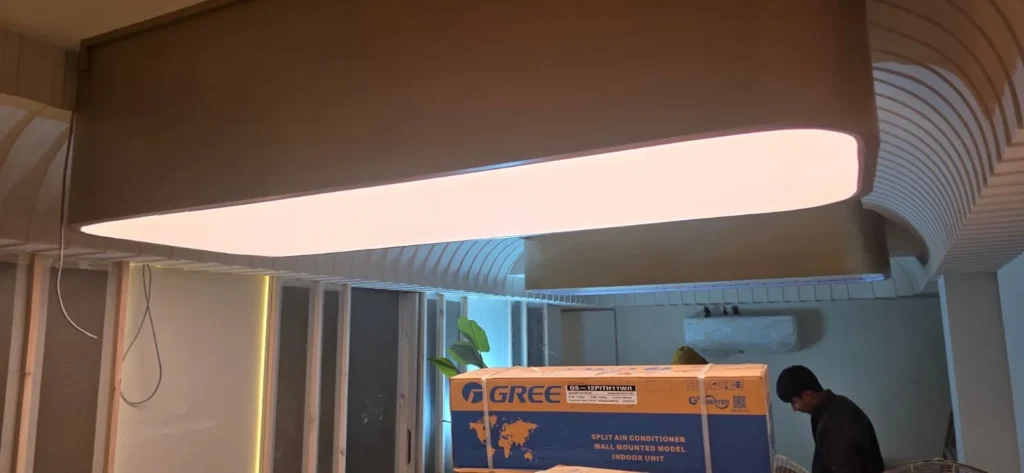 five oval and round white plain backlit stretch fabric ceilings glowing above the spa salon treatment and reception zones in Bahria Town Islamabad