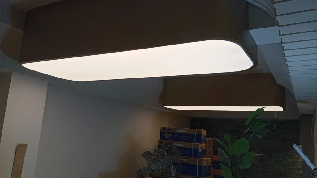 Finished composition of five oval and round white plain backlit stretch fabric ceilings glowing above the spa salon treatment and reception zones newon pakistan