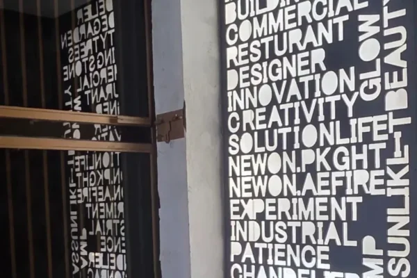 LED backlit CNC designed typographical playwall at Newon Lighting display centre Islamabad showing custom lighting words innovation creativity facade garden chandelier