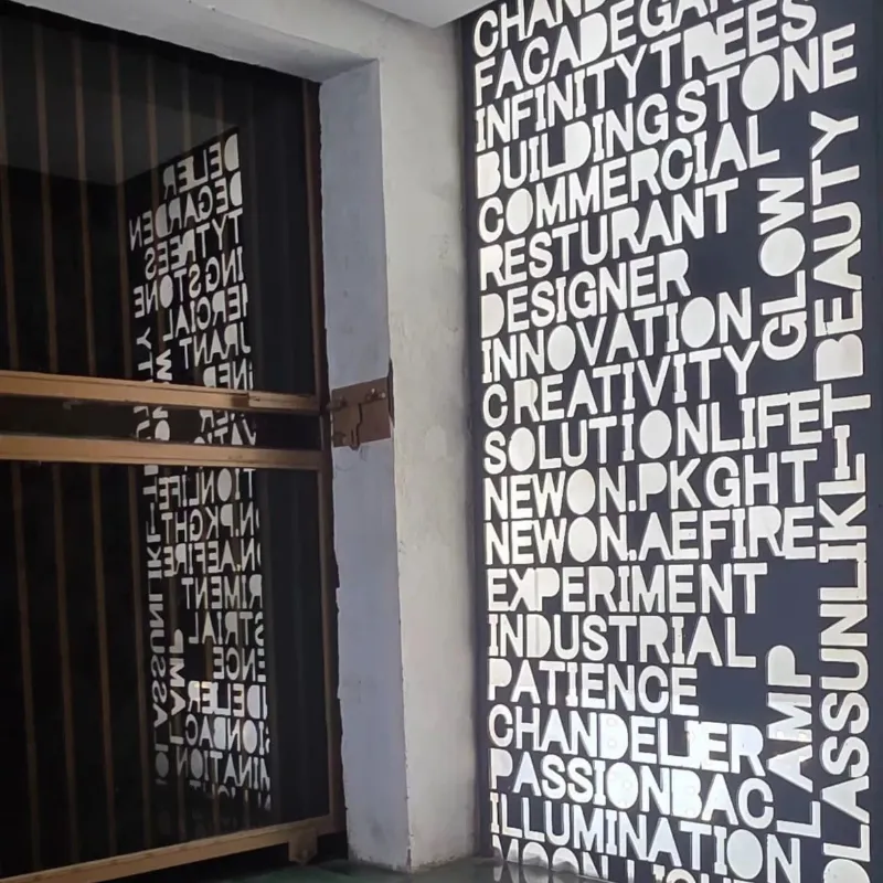 LED backlit CNC designed typographical playwall at Newon Lighting display centre Islamabad showing custom lighting words innovation creativity facade garden chandelier