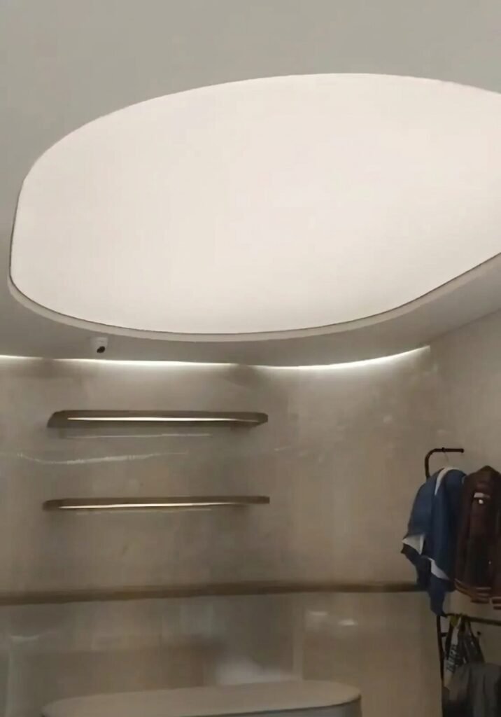oval stretch fabric ceiling tuned to warm white evening scene via RF remote