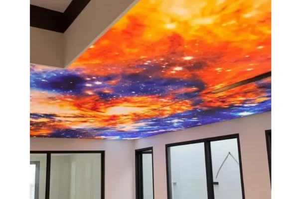 Galaxy printed backlit stretch fabric ceiling glowing above an indoor swimming pool in Defence, Karachi