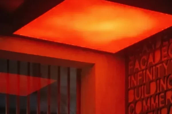 RGBW backlit stretch fabric ceiling displaying a warm golden hour sunset gradient in a luxury living room